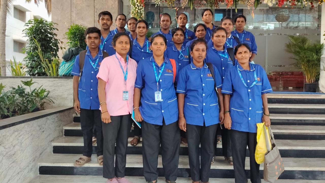SDC housekeeping team in blue uniforms at a client lobby